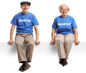 Group of volunteer with blue shirts sitting Volunteer Kamloops Referral