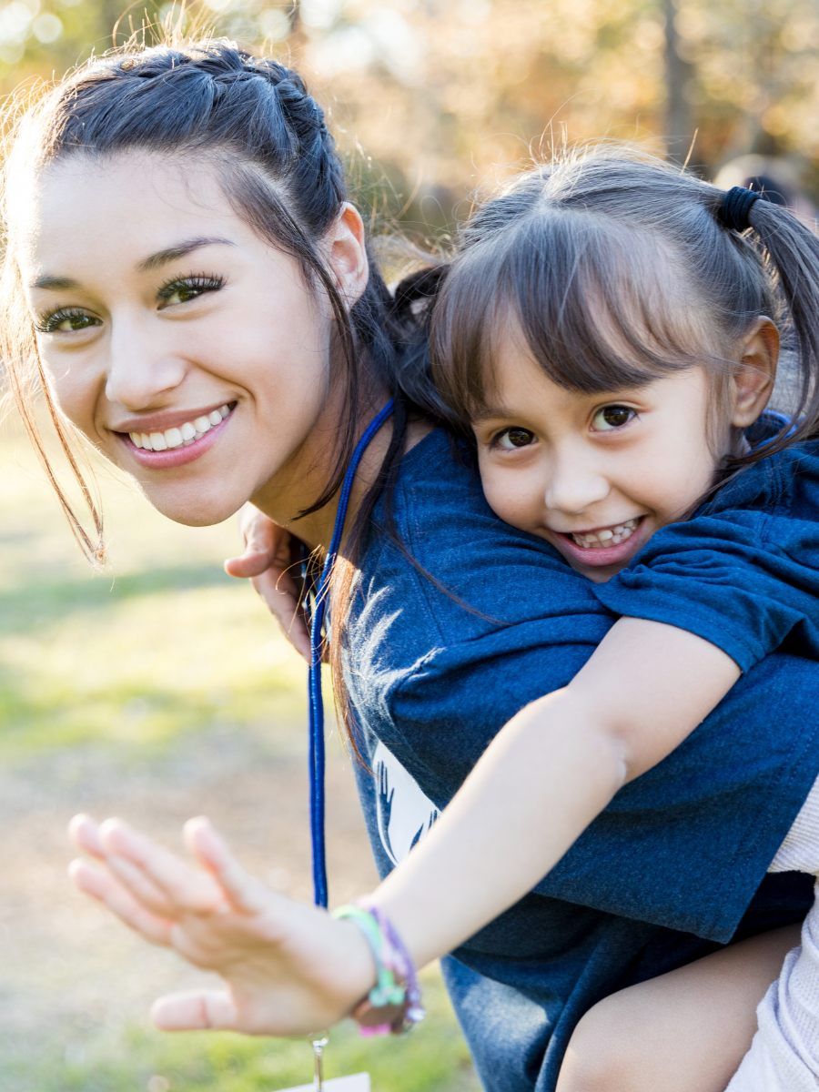 Volunteer with child smiling Volunteer Kamloops