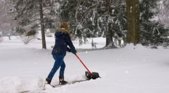 Volunteer shovelling snow Volunteer Kamloops Snow Angels Program