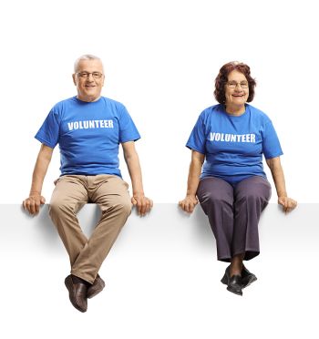 Volunteers in blue shirts sitting Volunteer Criteria Volunteer Kamloops